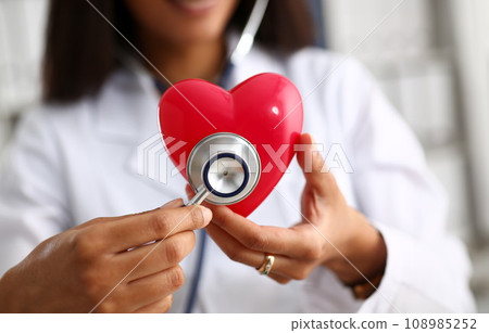 Beautiful black smiling female doctor hold 108985252