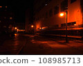 A back alley leading to the night town 108985713
