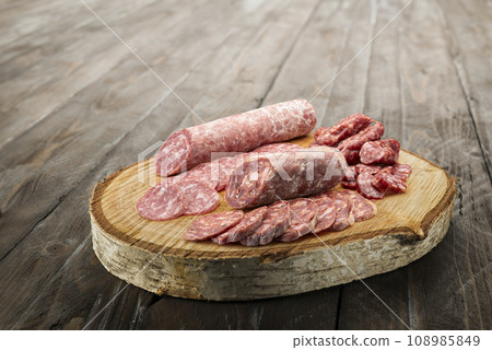 Sliced salami on board 108985849