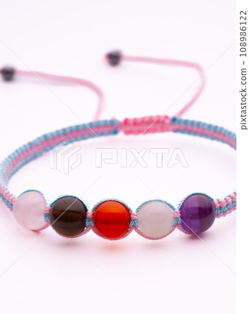 Men's bracelet made of brown stone. All the details are in focus. 108986122