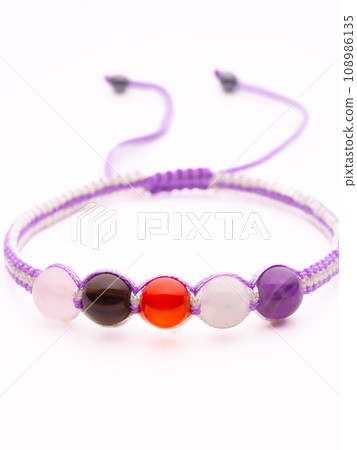 Men's bracelet made of brown stone. All the details are in focus. Men's bracelet made of brown stone. All the details are in focus. 108986135