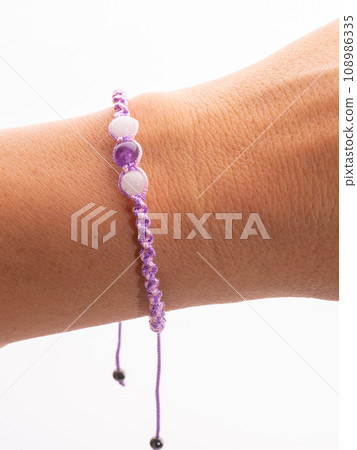 Collection of crystal gemstones bracelets on the table. Collection of crystal gemstones bracelets on the table. 108986335