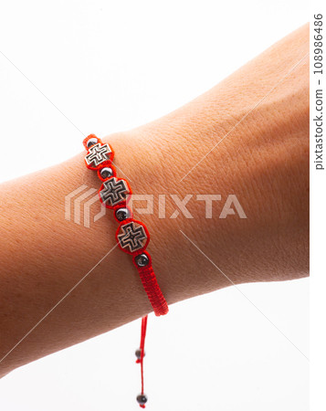 Collection of crystal gemstones bracelets on the table. 108986486