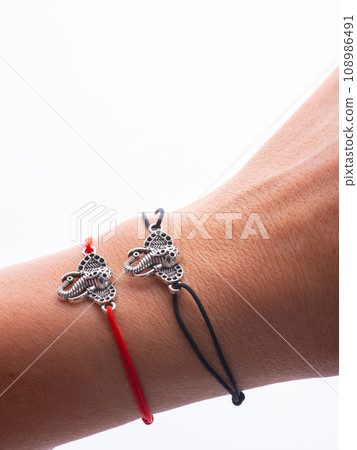 two pair bracelets are made of Korean rope and there is a love emblem that can be fused because there are magnets in it. two pair bracelets are made of Korean rope and there is a love emblem that can be fused because there are magnets in it. 108986491