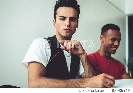 skilled man and woman working at desktop, concept of organisation and planning time skilled man and woman working at desktop, concept of organisation and planning time 108986549