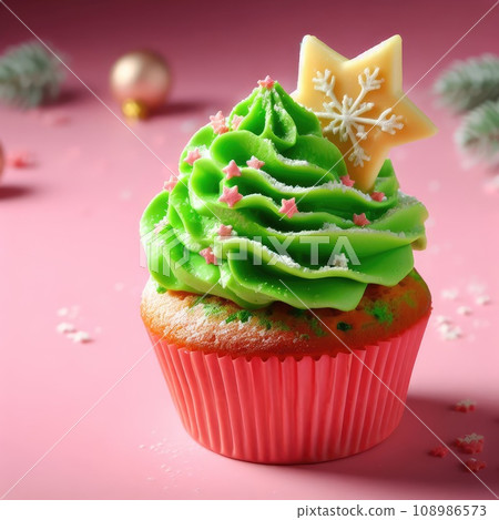 Christmas delicious cupcake with green whipped cream and star on pink background. Xmas dessert. 108986573