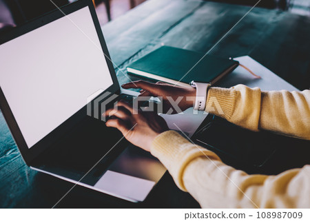 millennial woman working remotely on modern netbook 108987009