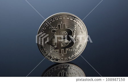 Coin of crypto currency bitcoin on a gray-blue Coin of crypto currency bitcoin on a gray-blue 108987150