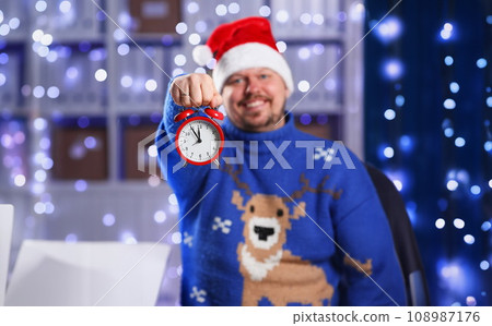 Bearded smiling man wearing warm blue sweater Bearded smiling man wearing warm blue sweater 108987176