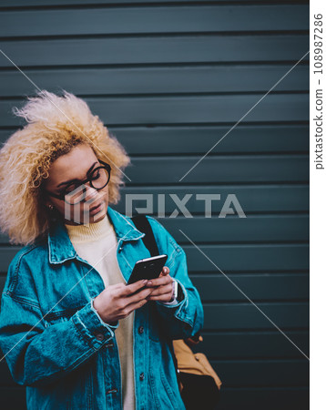 attractive female student searching media file attractive female student searching media file 108987286