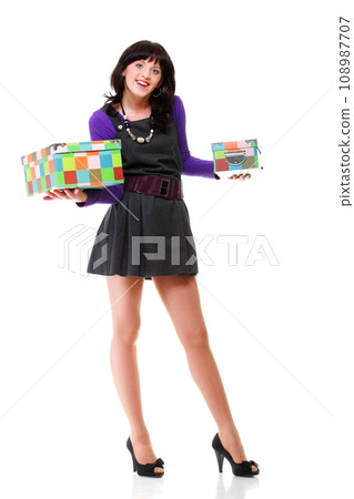 Woman carrying moving boxes. Young woman with box isolated 108987707
