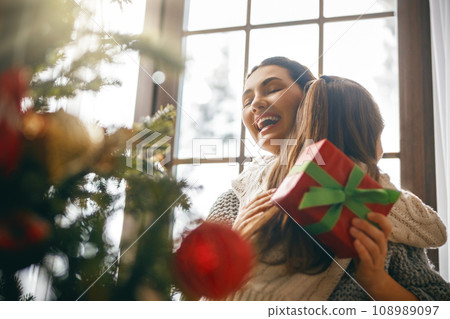 family celebrating Christmas 108989097