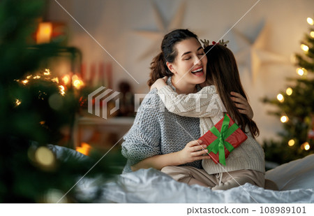 family celebrating Christmas 108989101