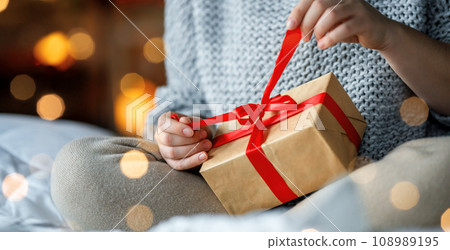 Hands with gift box. 108989195