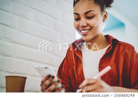 happy black girl chatting online with friends 108989249