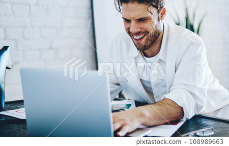 prosperous businessman celebrating success checking news on exchange prosperous businessman celebrating success checking news on exchange 108989663