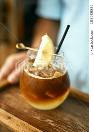 Black coffee with yuzu orange juice 108989822