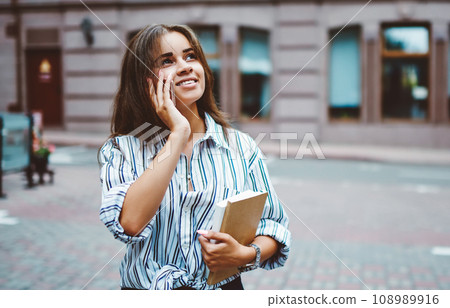 attractive hipster girl satisfied with connection making telephone call outdoors on leisure 108989916