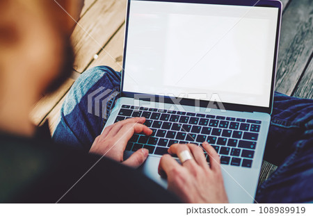 millennial man searching data information on website connected to 4g wireless internet 108989919