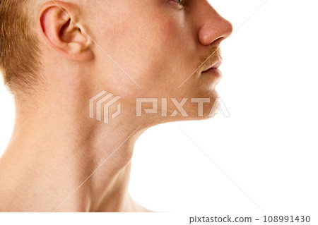 Cropped profile portrait of young man with well kept and healthy skin against white studio background. 108991430