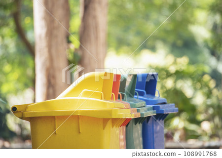 Trash cans for sorting garbage recycle bin waste plastic container collection. Reuse, reduce, recycle sorting process sustainable lifestyle rubbish dustbin plastic box in green garden. 108991768