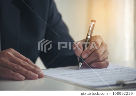 Businessman hand using pen signing on new contract to starting projects in conference room. Close up business manager man hands sign contract legal document in meeting room. Business agreement concept 108992239