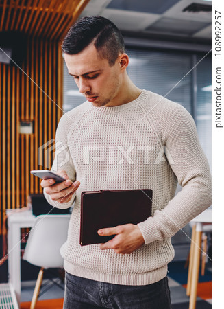 Pensive student checking email on cellular Pensive student checking email on cellular 108992257