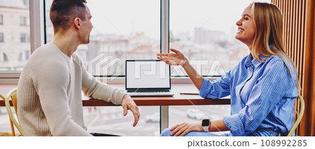 Collaboration of graphic designers sitting at table Collaboration of graphic designers sitting at table 108992285