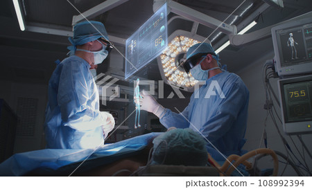 3D graphics of holographic display showing vital signs during surgery 108992394
