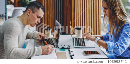 Young man and woman searching information 108992741