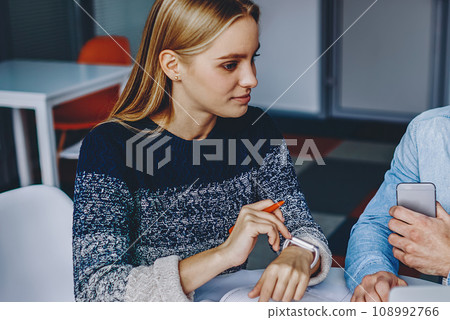 Collaboration of young man and woman preparing common studying project Collaboration of young man and woman preparing common studying project 108992766