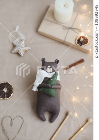 Christmas composition. Toy bear and decorations. Christmas, winter, new year concept. Flat lay, top view, copy space Christmas composition. Toy bear and decorations. Christmas, winter, new year concept. Flat lay, top view, copy space 108992948