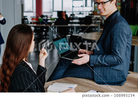 Crew of prosperous skilled male and female office workers having discussion about project, 108993154