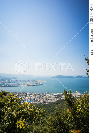 The cityscape of Takamatsu City and the Seto Inland Sea in summer seen from the summit of Yashima, Kagawa The cityscape of Takamatsu City and the Seto Inland Sea in summer seen from the summit of Yashima, Kagawa 108993426