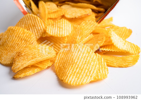 Potato chips, delicious BBQ seasoning spicy for crips, thin slice deep fried snack fast food in open bag. 108993962