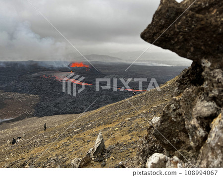 Tourists Watching Volcanic Eruption in Iceland 2023. 108994067
