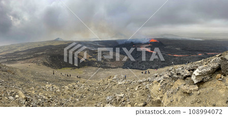 Tourists Watching Volcanic Eruption in Iceland 2023. 108994072