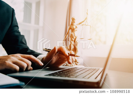 Business and lawyers discussing contract papers with brass scale on desk in office. Law, legal services, advice, justice and law concept picture with film grain effect 108998518