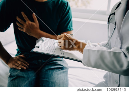 Doctor telling to patient woman the results of her medical tests. Doctor showing medical records to cancer patient in hospital ward. Senior doctor explaint the side effects of the intervention. 108998543