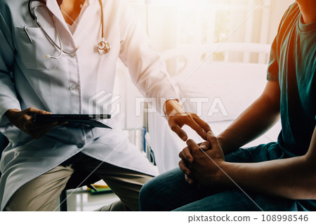 Doctor telling to patient woman the results of her medical tests. Doctor showing medical records to cancer patient in hospital ward. Senior doctor explaint the side effects of the intervention. 108998546