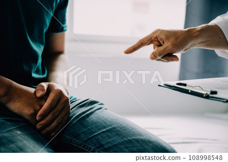 Doctor telling to patient woman the results of her medical tests. Doctor showing medical records to cancer patient in hospital ward. Senior doctor explaint the side effects of the intervention. 108998548