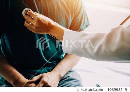 Doctor telling to patient woman the results of her medical tests. Doctor showing medical records to cancer patient in hospital ward. Senior doctor explaint the side effects of the intervention. 108998549