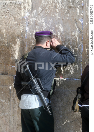 Jewish man pray at the western wall in Jerusalem, IL. Jewish man pray at the western wall in Jerusalem, IL. 108998742