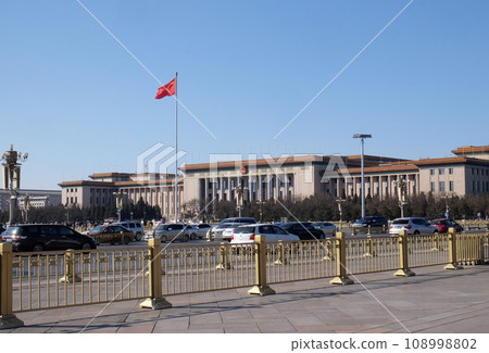 Flag of China on the mast in Tiananmen Square. It's the third largest square in the world and important site in Chinese history, in Beijing. 108998802