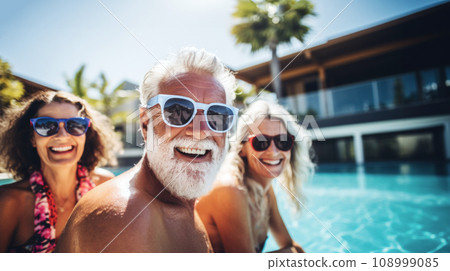 A group of charismatic seniors in warm companionship and sunshine in Pool, their energy and stylish sunglasses a testament to enduring youthfulness, Vitality Style, Enjoyment and Youthful Spirit A group of charismatic seniors in warm companionship and sunshine in Pool, their energy and stylish sunglasses a testament to enduring youthfulness, Vitality Style, Enjoyment and Youthful Spirit 108999085