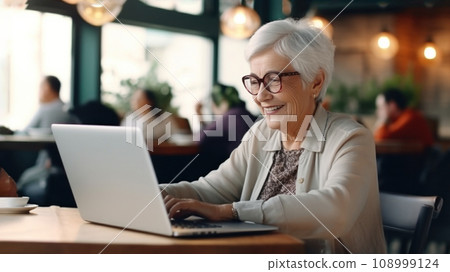 Elder cheerful smiling woman, enjoys social atmosphere, navigating the internet, traditional wisdom, modern technology, digitally connection for senior, exemplifying lifelong learning and engagement Elder cheerful smiling woman, enjoys social atmosphere, navigating the internet, traditional wisdom, modern technology, digitally connection for senior, exemplifying lifelong learning and engagement 108999124