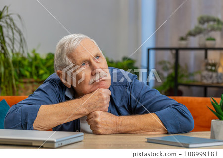 Senior man at home suffers from unfair situation problem break up depression bad sick ill annoyed 108999181