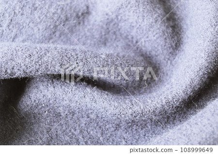 Close-up texture of gray wool fabric for background. Macro photo of textile material. Close-up texture of gray wool fabric for background. Macro photo of textile material. 108999649