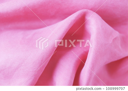 Pink satin fabric texture background. Abstract background and texture for design. Pink satin fabric texture background. Abstract background and texture for design. 108999707