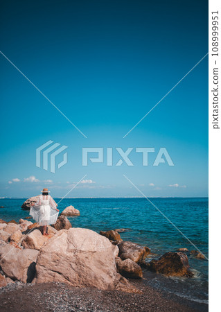 Elegant woman against the Turkish sea 108999951